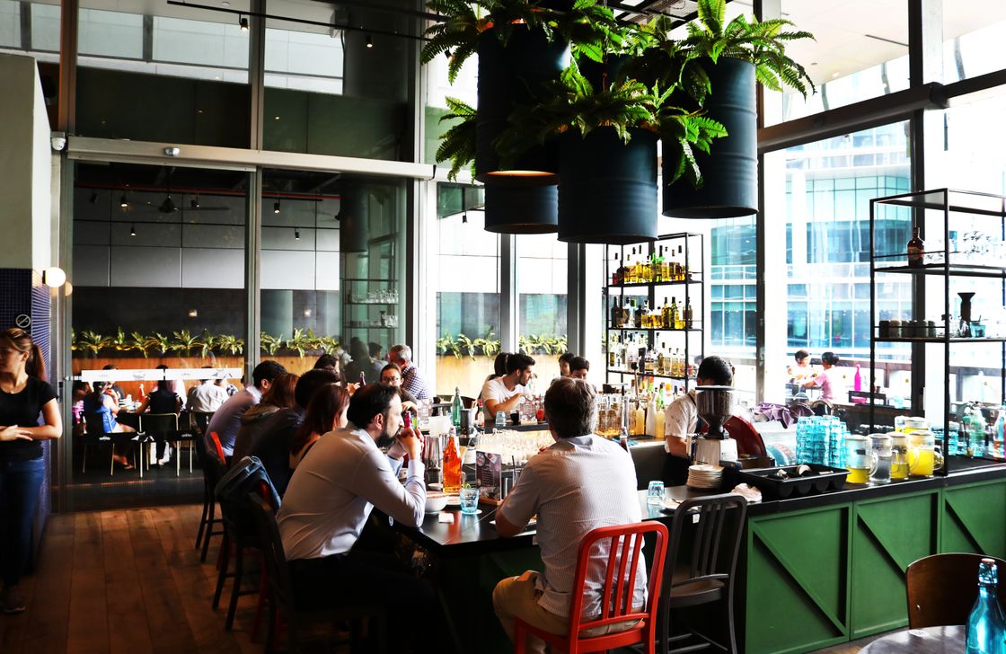 Diners at a Nice Work restaurant in Singapore